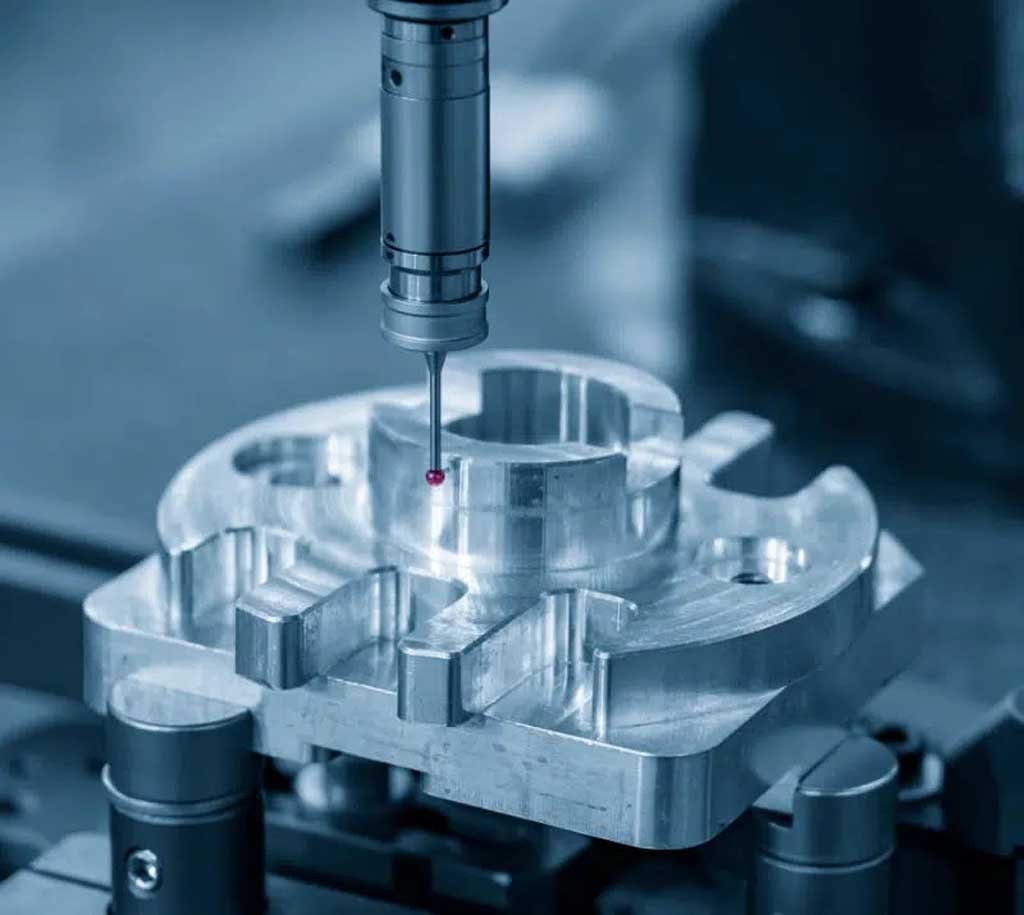Precision CNC machine probe inspecting a complex metal part in a manufacturing setup.